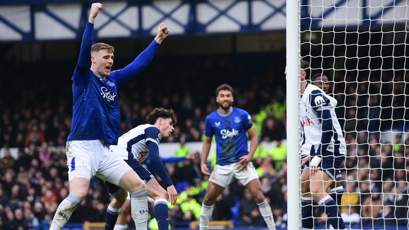 Everton and Republic of Ireland defender Jake O'Brien raises his arms in celebration after going 3-0 up