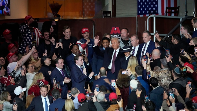 President Donald Trump arrives to the inauguration parade at Capital One Arena in Washington
