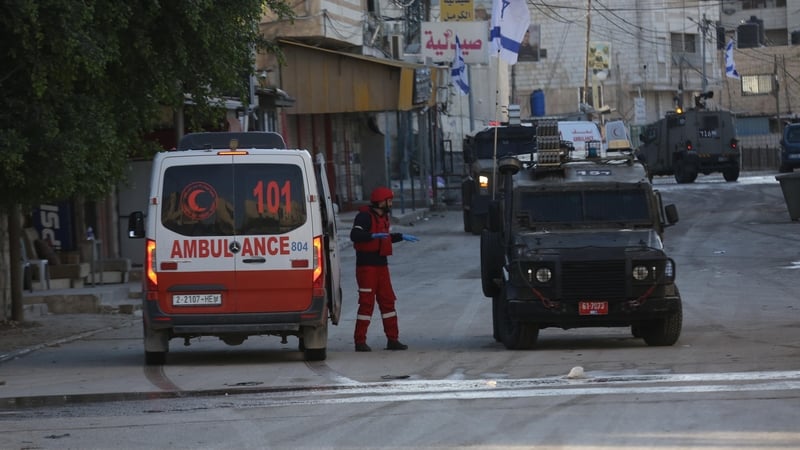 Paramedics respond to treat those injured in an Israeli military attack on a refugee camp in Jenin in the occupied West Bank