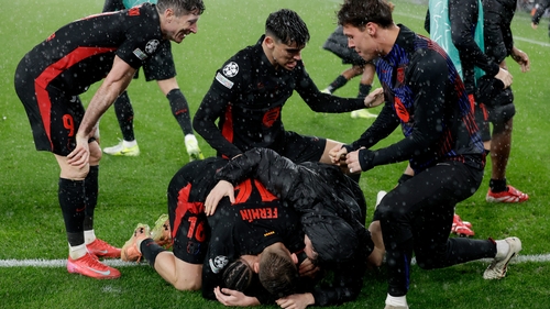 Raphinha is joined by team-mates after scoring Barcelona's dramatic match-winning goal