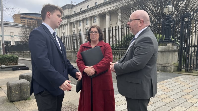 Gabriel McConkey, pictured with his parents, outside the High Court today