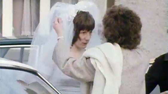 Final adjustments are made to a bride's veil in Newcastle, County Tipperary, 1980.