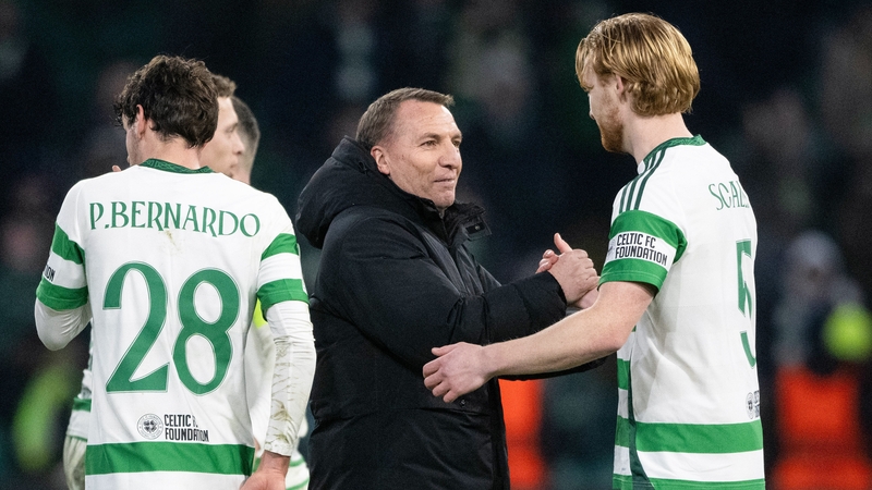 Celtic manager Brendan Rodgers (L) and Liam Scales at full time