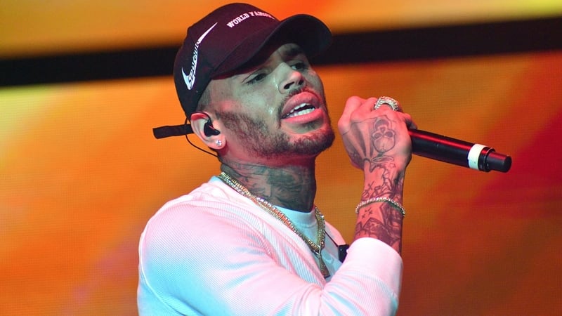 R&B singer Chris Brown has been arrested in Manchester over an alleged bottle attack at a London nightclub two years ago