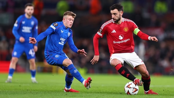Connor Barron presses Bruno Fernandes at Old Trafford