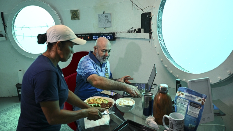 German aerospace engineer Rudiger Koch has breakfast inside an underwater room off the coast of Panama