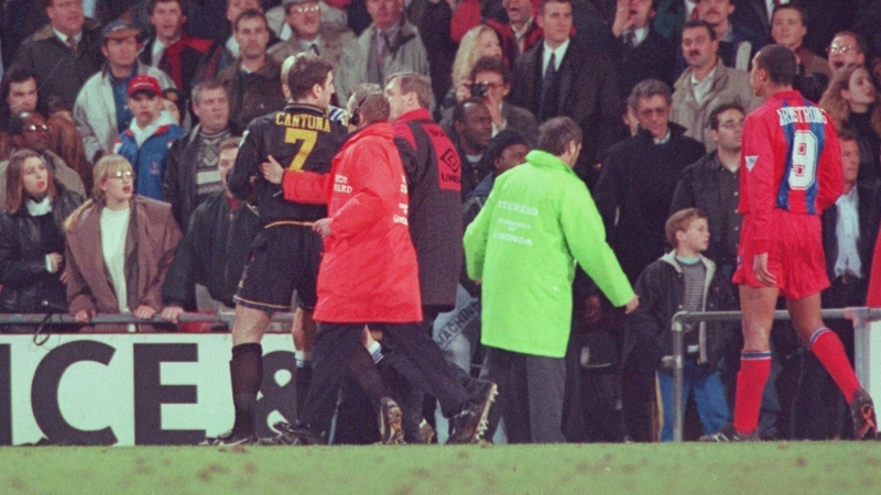 Eric Cantona is escorted off the pitch after his iconic moment of madness/brilliance