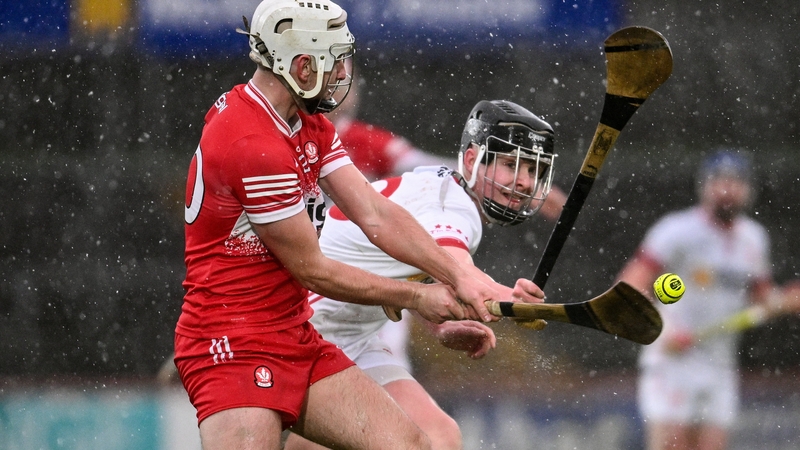 Derry's Callum O'Kane (L) IN action against Tyrone's Aidan Woods