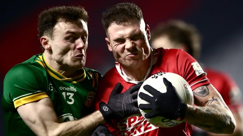 Sean Walsh of Cork (R) shoulders into Meath's Jordan Morris