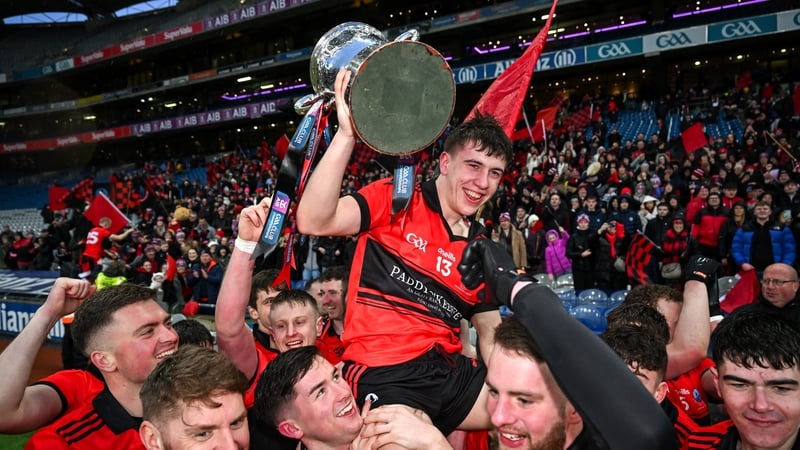 Fionan Ó Conghaile holds the trophy after his winning score secured glory for An Cheathrú Rua