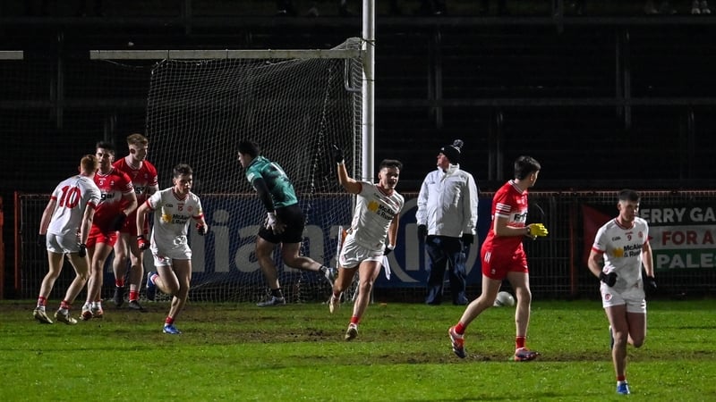 Michael McKernan (C) celebrates after scoring Tyrone's first goal