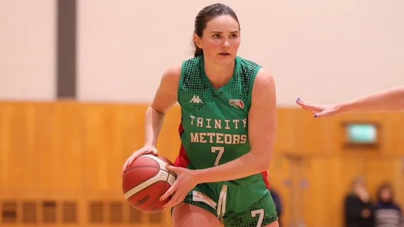 Sarah Kenny of Trinity Meteors in action against FloMAX Liffey Celtics