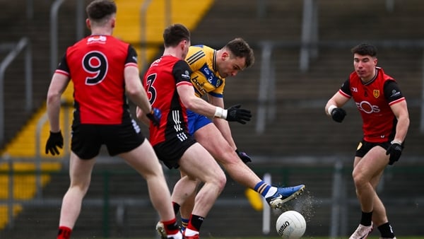 Enda Smith of Roscommon steers home a goal against Down