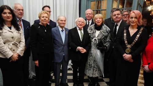 Michael D Higgins and his wife Sabina with Holocaust survivors Suzi Diamond (third left) and Tomi Reichenthal (fourth left) as they arrived at a Holocaust Memorial Day event at the Mansion House
