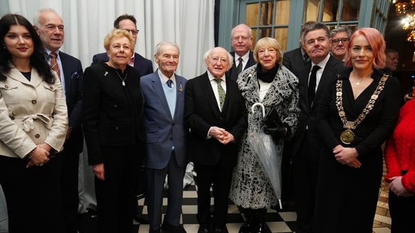 Michael D Higgins and his wife Sabina with Holocaust survivors Suzi Diamond (third left) and Tomi Reichenthal (fourth left) as they arrive at a Holocaust Memorial Day event at the Mansion House