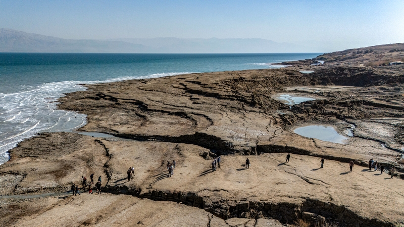 An aerial view of the Dead Sea showing sinkholes that have formed as the sea has declined by one metre a year since the 1960s