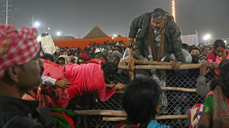 Pilgrims try to escape from the stampede at the Maha Kumbh Mela festival in Prayagraj