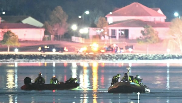 Rescue boats search the Potomac river after a US army helicopter approaching Reagan National Airport collided with a passenger plane