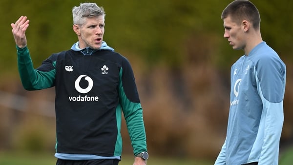 Simon Easterby talks to Sam Prendergast at training in Portugal