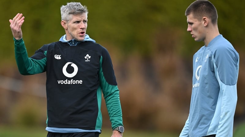 Simon Easterby talks to Sam Prendergast at training in Portugal