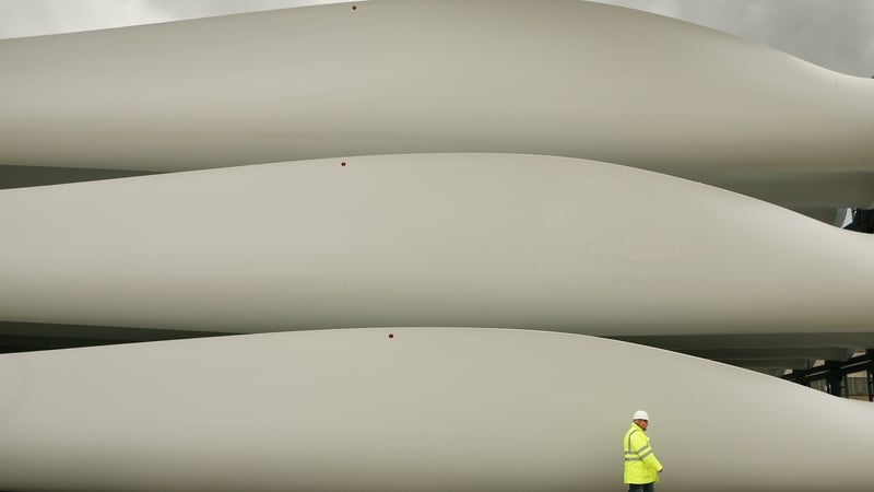 A worker walks past stored wind turbine blades at the Harland & Wolff shipyard in Belfast in 2008. Photo: Peter Macdiarmid/Getty Images