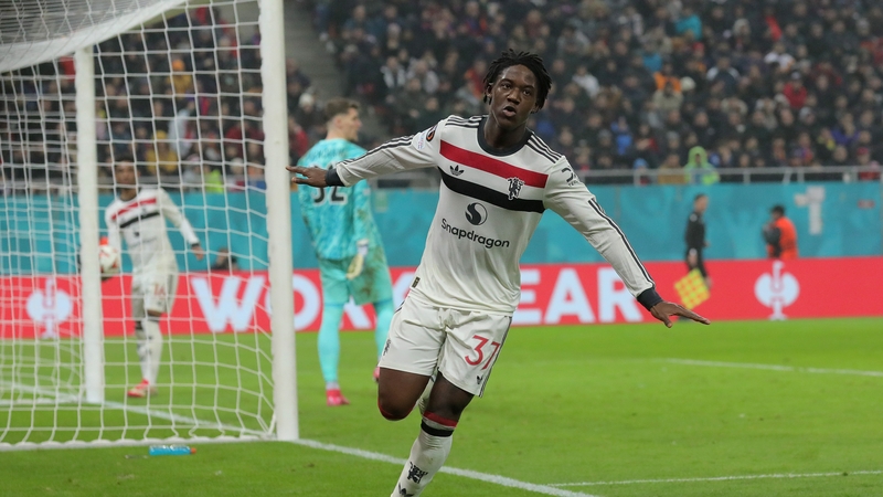 Kobbie Mainoo wheels away after scoring Man United's second goal