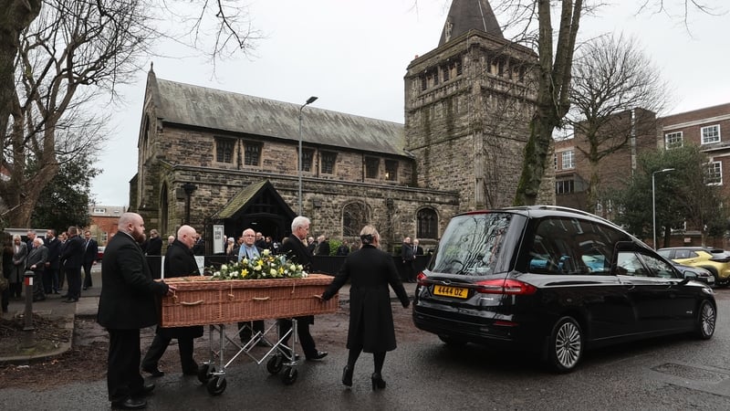 The caskey is taken from the church following the service