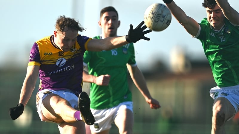 Mark Rossiter gets a shot away despite the attentions of Andrew Meade