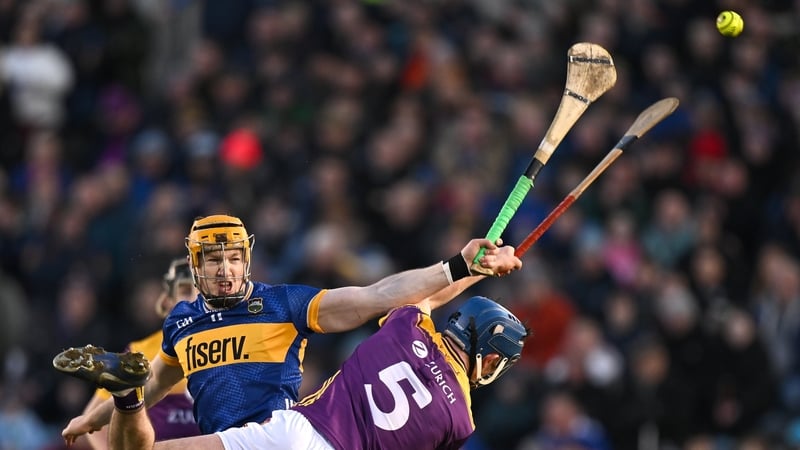 Jake Morris of Tipperary in action against Charlie McGuckin of Wexford