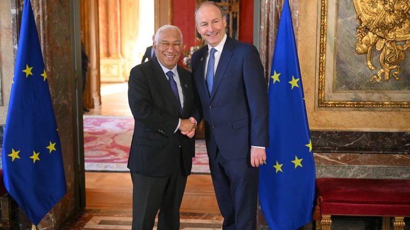 European Council President Antonio Costa (L) greets Taoiseach Micheál Martin as he arrives for an informal EU leaders' retreat in Brussels