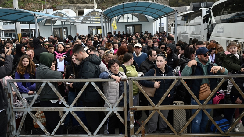 People queue to get a ferry off the island of Santorini after 'intense' tremors