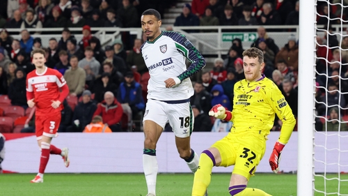 Mark Travers makes a clearance despite the presence of Sunderland's Wilson Isidor