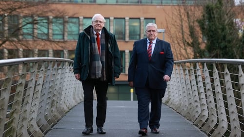 Michael Gallagher (L) and Stanley McCombe on their way into the inquiry this morning