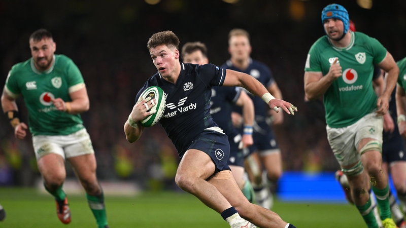 Huw Jones scoring late on in last year's Six Nations clash at the Aviva Stadium