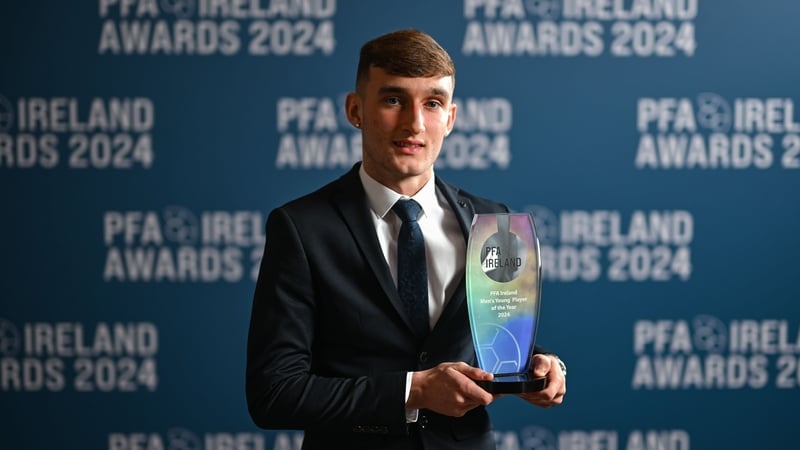 Mason Melia with the 2024 Young Player of the Year award