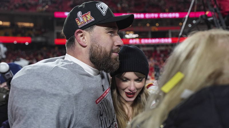 Travis Kelce celebrates the Chiefs' AFC championship last month with Taylor Swift