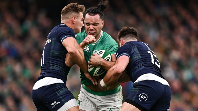 Scotland's Duhan van der Merwe, left, and team-mate Huw Jones attempt to stop Ireland winger James Lowe during the 2024 Six Natiosn clash