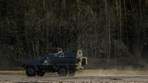 A Ukrainian armoured Dozor-B travels on the road near the border with Russia in Sumy Oblast region