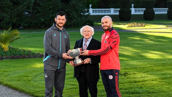 President Michael D Higgins, with Ryan Brennan of FAI Cup winners Drogheda United and Mark Coyle of league champions Shelbourne at Áras an Uachtaráin this week