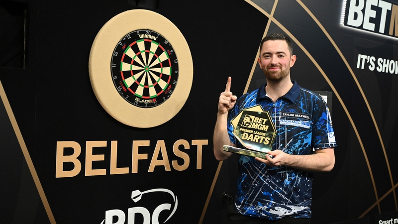 Luke Humphries celebrates after his victory over Chris Dobey in Belfast