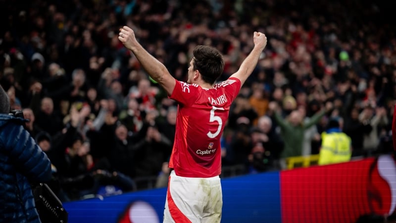Harry Maguire celebrates in front of fans after scoring Man United's controversial winner against Leicester