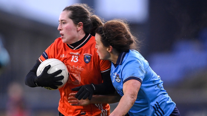 Niamh Reel of Armagh with posession ahead of Leah Caffrey