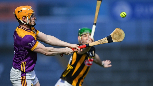Wexford's Simon Donohoe is tackled by Eoin Cody of Kilkenny