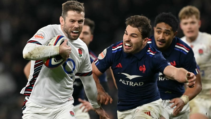 Elliot Daly fends off Antoine Dupont on his way to the winning try