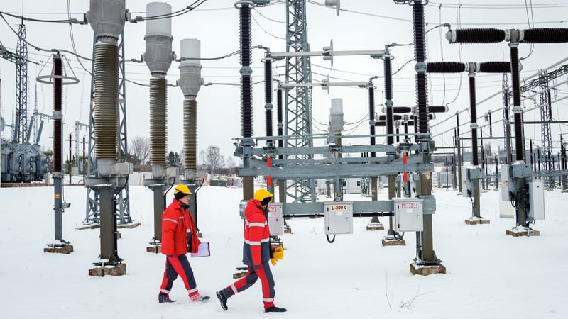 Technicians arrive at the power substation in Rezekne, Latvia to disconnect the major power line between Latvia and Russia