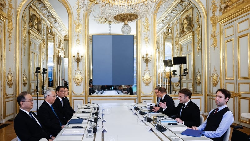 China's Vice Premier Zhang Guoqing (2L) and President Emmanuel Macron participate in a meeting during the Artificial Intelligence (AI) Action Summit, at the Elysee Palace