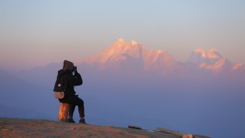 Mountain ranges appear grey in the absence of sufficient winter rain or snowfall, as seen from a hill station in Dolakha district in Central Nepal