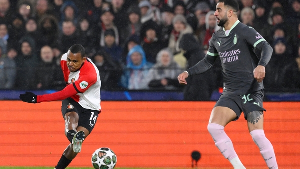 Igor Paixao (L) shoots and scores as Kyle Walker looks on