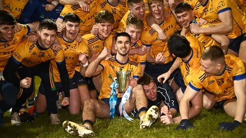 DCU captain Ciarán Caulfield with the cup as he celebrates with team-mates after their side's victory