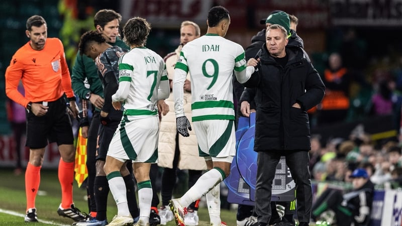 Celtic's Adam Idah (L) with manager Brendan Rodgers as he was subbed off in the 2-1 defeat